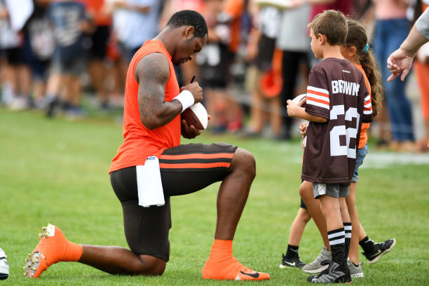Deshaun Watson of the Cleveland Browns signs autographs for fans after Cleveland Browns training camp at CrossCountry Mortgage Campus on August 09,...