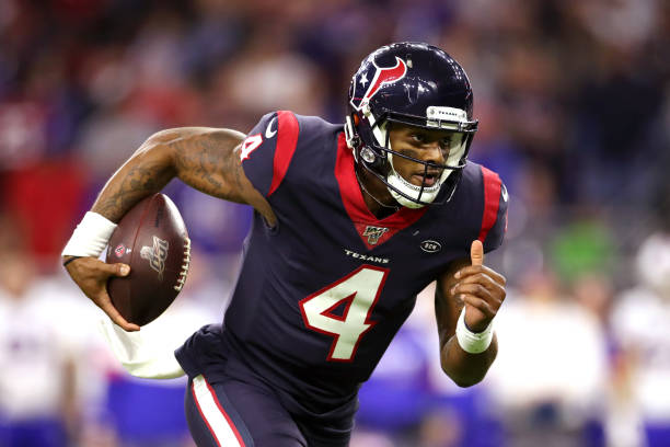 Deshaun Watson of the Houston Texans runs the ball for a touchdown against the Buffalo Bills during the third quarter of the AFC Wild Card Playoff...