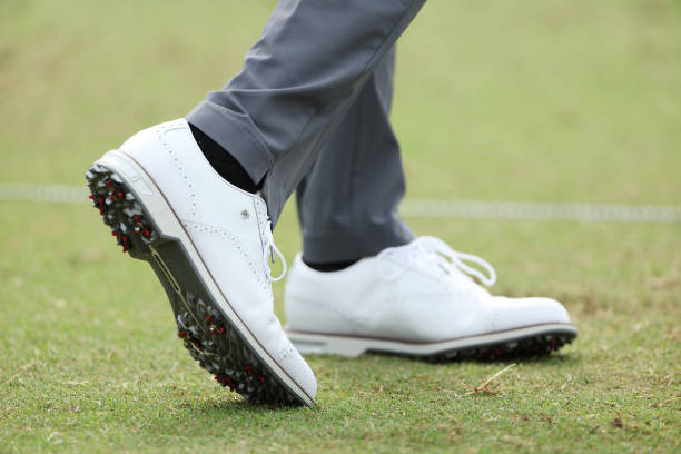 Detailed view of shoes worn by Tiger Woods of the United States are seen as he plays on the practice range during a practice round prior to the start...