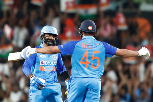 Dinesh Karthik and Rohit Sharma of India celebrate the victory during game two of the T20 International series between India and Australia at...