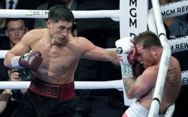 Dmitry Bivol throws a left at Canelo Alvarez in the fifth round of their WBA light heavyweight title fight at T-Mobile Arena on May 07, 2022 in Las...