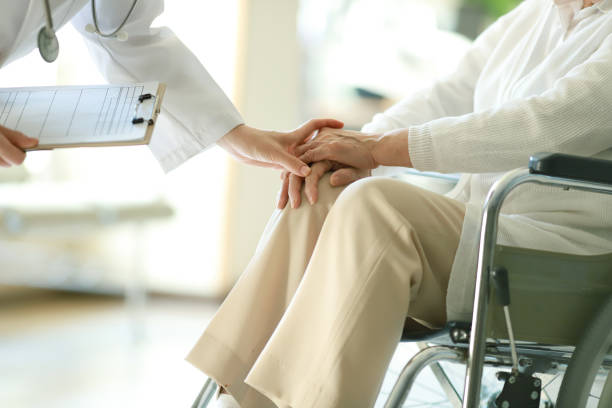doctor examining patient in wheelchair picture id1067908128?k=20&m=1067908128&s=612x612&w=0&h=CeKC54r3M3pIfxn56uhjdceu5OsE NeQtbG7mzGU90A= - Illnesses, Causes, and Their Cures.