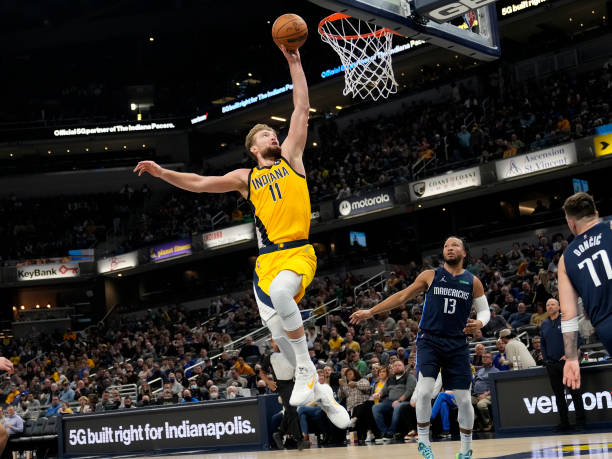 Domantas Sabonis of the Indiana Pacers dunks the ball against the Dallas Mavericks on December 10, 2021 at Gainbridge Fieldhouse in Indianapolis,...