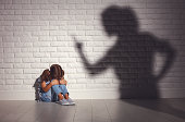 domestic violence. angry mother scolds   frightened daughter