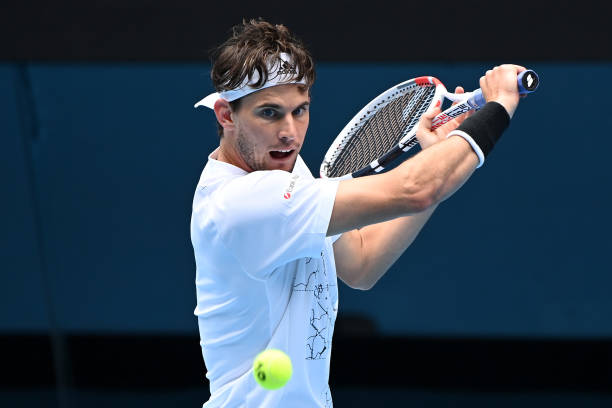 Dominic Thiem of Austria plays a backhand in his Men's Singles first round match against Mikhail Kukushkin of Kazakhstan during day one of the 2021...