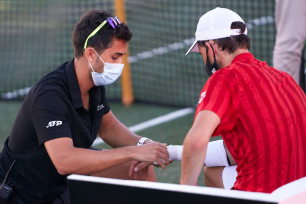 Dominic Thiem of Austria receives medical treatment during his Round of 16 match against Adrian Mannarino of France on day four of the Mallorca...
