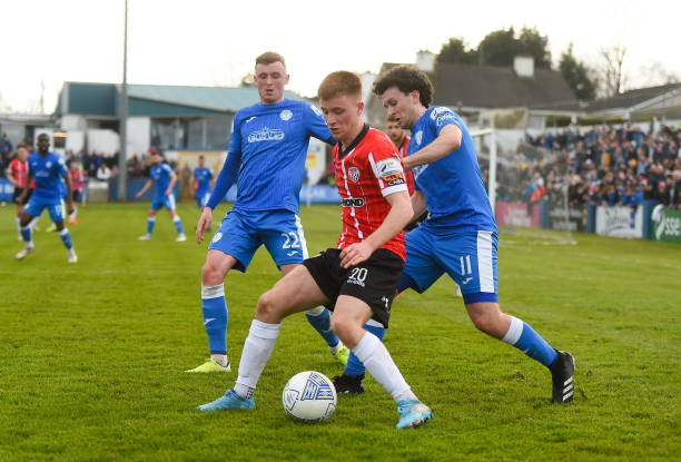 Donegal , Ireland - 9 April 2022; Brandon Kavanagh of Derry City in action against Ryan Rainey and Barry McNamee of Finn Harps during the SSE...