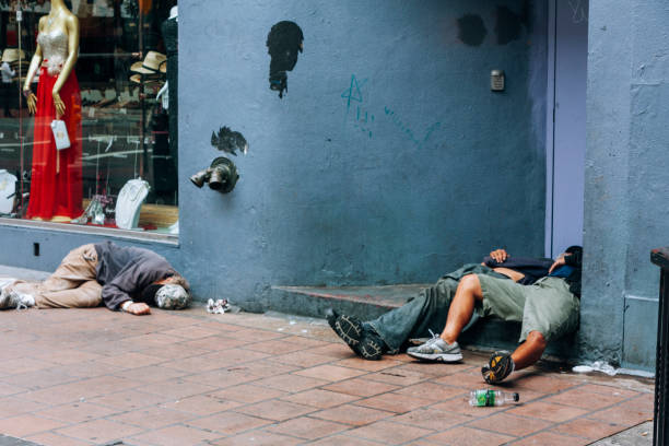 drunk homeless people lying on san diego street - drunken bum stock pictures, royalty-free photos & images