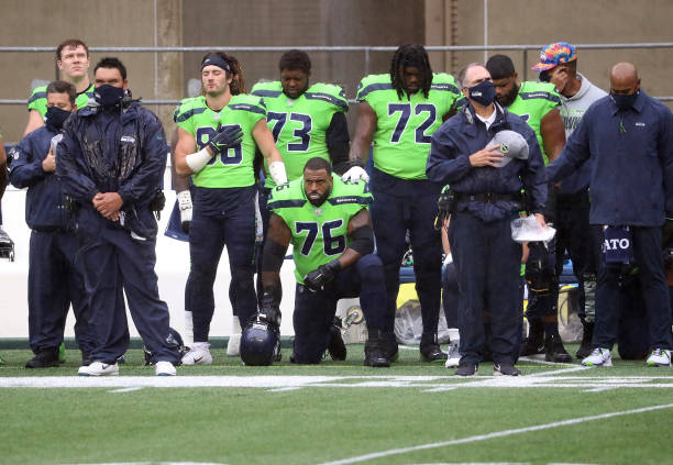 Duane Brown of the Seattle Seahawks takes a knee during the national anthem before the start of a game against the Minnesota Vikings at CenturyLink...