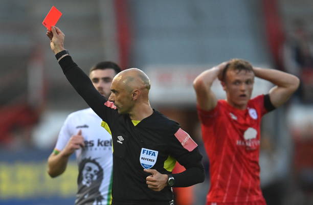 Dublin , Ireland - 19 August 2022; Referee Neil Doyle shows a red card to John Ross Wilson of Shelbourne during the SSE Airtricity League Premier...