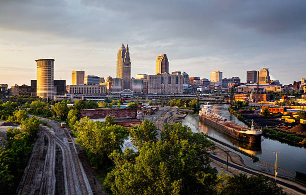 dusk skyline of downtown cleveland ohio with freighter on the river picture