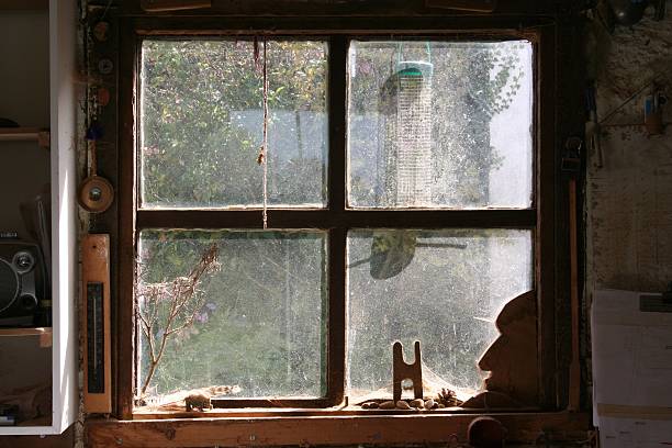 dusty window in woodworking workshop - looking through dirty window stock pictures, royalty-free photos & images