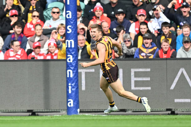 Dylan Moore of the Hawks celebrates a goal during the round six AFL match between the Hawthorn Hawks and the Sydney Swans at UTAS Stadium on April...