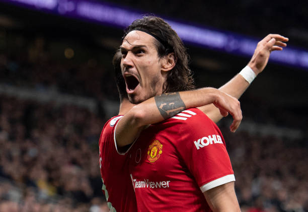 Edinson Cavani celebrates scoring Manchester United's second goal with Bruno Fernandes during the Premier League match between Tottenham Hotspur and...