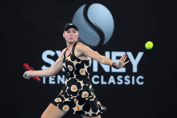 Elena Rybakina of Kazakhstan hits a return against Emma Raducanu of Britain during their women's singles match at the Sydney Classic tennis...