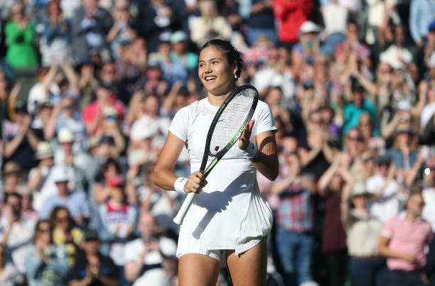 Emma Raducanu after winning her match against Alison Van Uytanck during Day One of The Championships Wimbledon 2022 at All England Lawn Tennis and...