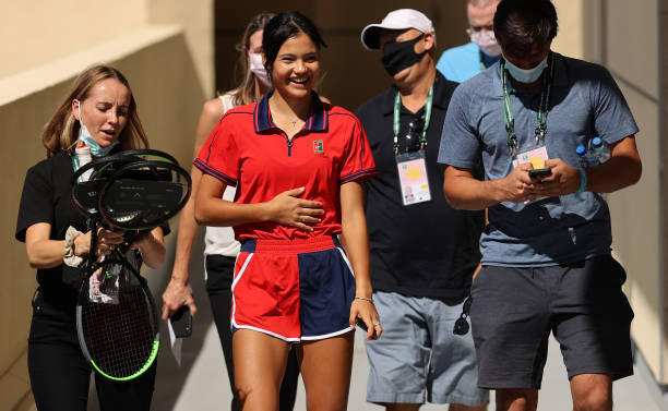 Emma Raducanu of Great Britain walks to do TV interviews on her pre-event media day on Day 2 of the BNP Paribas Open at the Indian Wells Tennis...