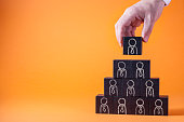 Employees are represented by wooden cubes. Business concept for human resources.