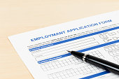 Employment application form with pen concept job applying