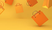 Empty orange color shopping bag on the yellow background, copy space text, Design creative concept for halloween day or autumn sale event.