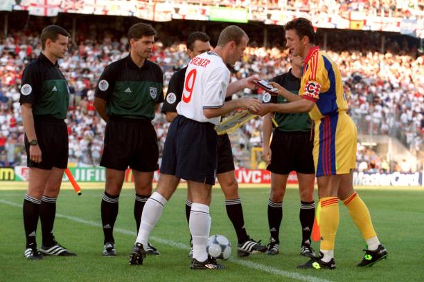 englands-alan-shearer-and-romanias-gheorghe-popescu-shake-hands-and-picture-id650887944