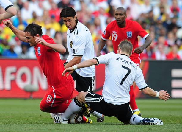 England's Frank Lampard is fouled by Germany's Bastian Schweinsteiger