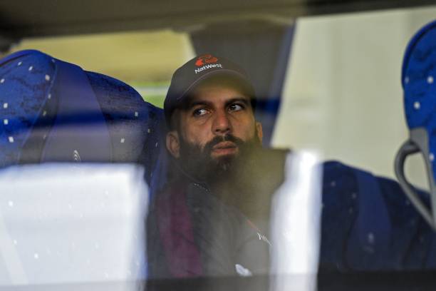 Englands Moeen Ali sits inside a bus upon his arrival at the Rajapaksa international airport in Mattala on January 3 as England's cricket team...