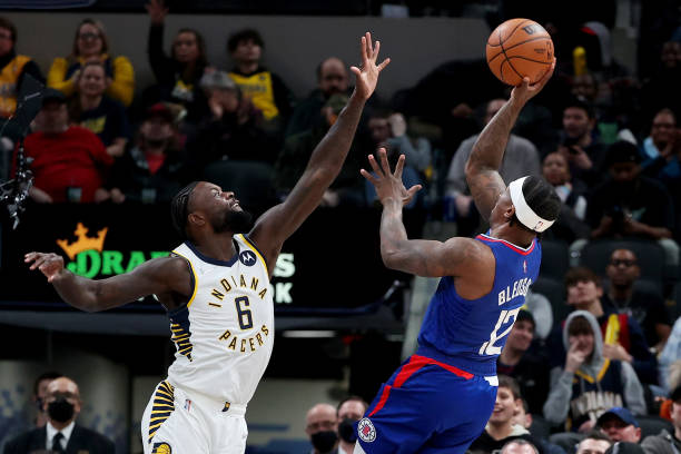 Eric Bledsoe of the Los Angeles Clippers attempts a shot while being guarded by Lance Stepenson of the Indiana Pacers in the fourth quarter at...