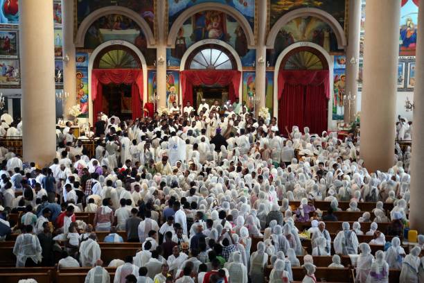Ethiopian Orthodox Christians take part in the religious mass during the Good Friday at the Medhane Alem Cathedral in Addis Ababa, Ethiopia on April...