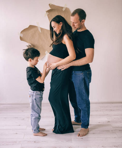 European pregnant family with one child, waiting for little brother