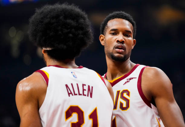 Evan Mobley and Jarrett Allen of the Cleveland Cavaliers look on against the Toronto Raptors during the first half of their basketball game at the...