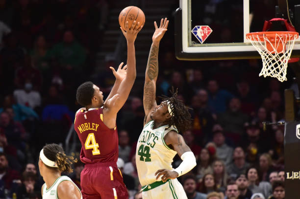 Evan Mobley of the Cleveland Cavaliers shoots over Robert Williams III of the Boston Celtics during the second half at Rocket Mortgage Fieldhouse on...