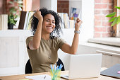 Excited black woman feel euphoric reading god news online