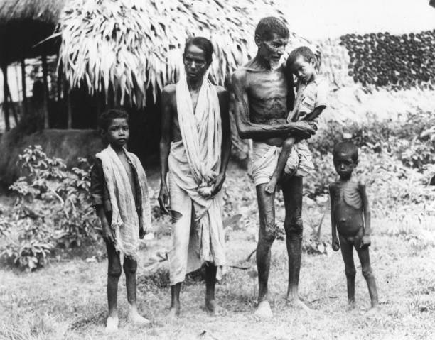 Family of semi-starved Indians who have arrived in Calcutta in search of food.