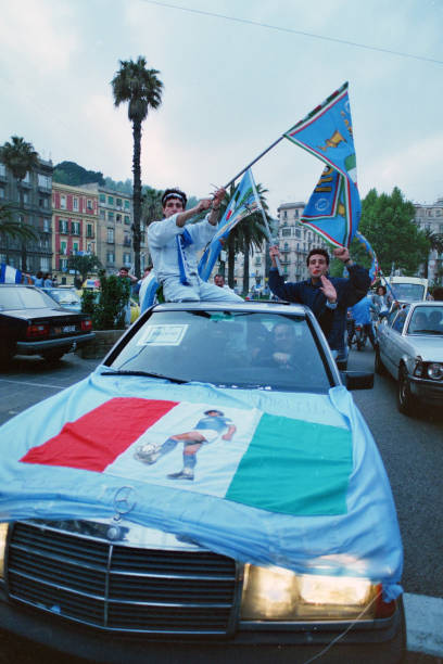 Fans celebrate Napoli's season champions after the Serie A match between Napoli and Fiorentina on May 10, 1987 in Naples, Italy.