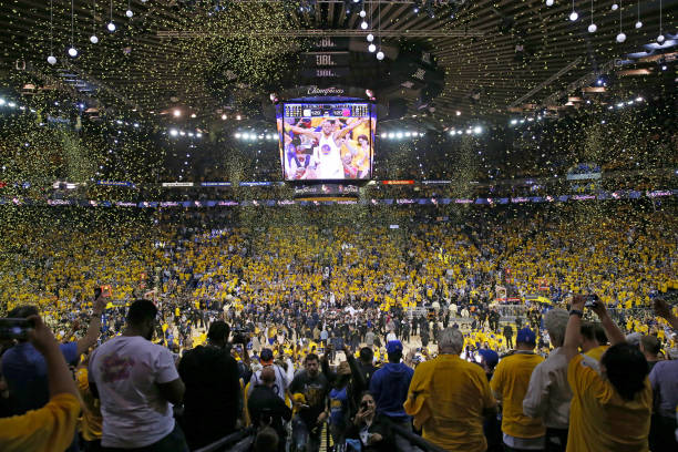 Fans cheer as the Golden State Warriors celebrate after defeating the Cleveland Cavaliers 129-120 in Game 5 to win the 2017 NBA Finals at ORACLE...
