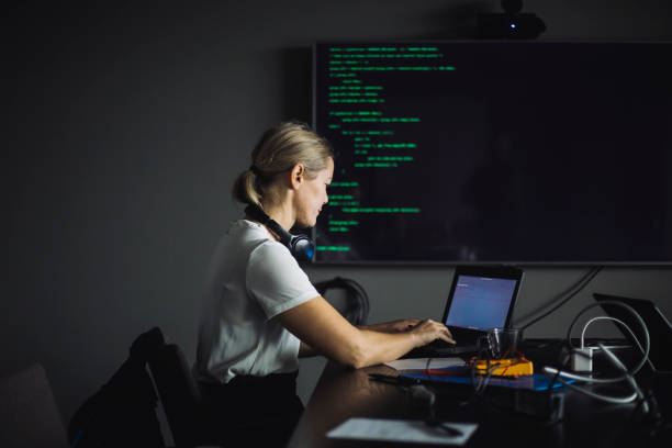 female it professional typing on laptop in creative office - software development stock pictures, royalty-free photos & images