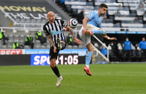 Ferran Torres of Manchester City flicks the ball in for the second City goal as Jonjo Shelvey challenges during the Premier League match between...