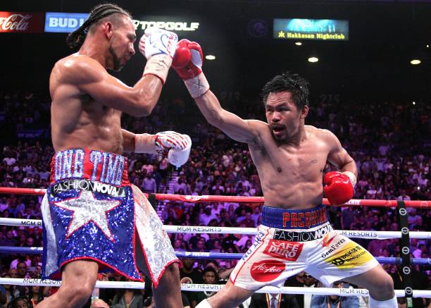 Filipino boxer Manny Pacquiao and US boxer Keith Thurman during their WBA super world welterweight title fight at the MGM Grand Garden Arena on July...
