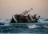 Fishing vessel boat aground on sea