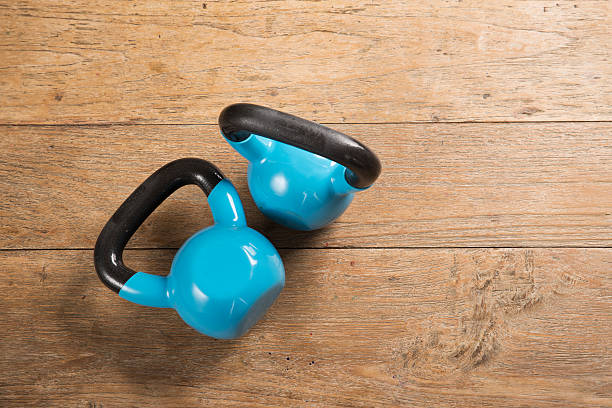 flat lay image of kettlebells on a wooden floor picture id626558790?k=20&m=626558790&s=612x612&w=0&h=jrOIvIS0