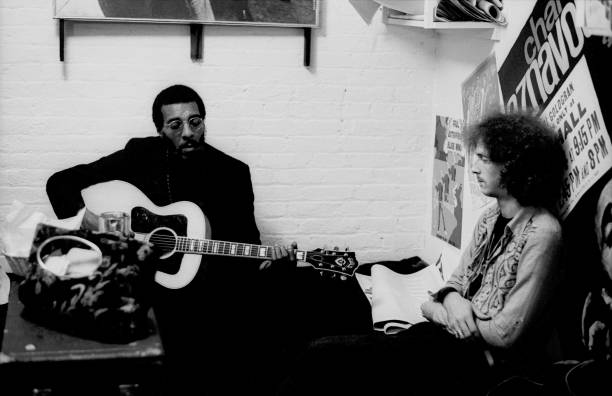 folk-singer-richie-havens-and-eric-clapton-backstage-at-the-cafe-au-picture-id115058830
