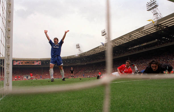 Football, 1997 FA Cup Final, Wembley, 17th May Chelsea 2 v Middlesbrough 0, A view from inside the goal showing Chelsea's Mark Hughes celebrating the...
