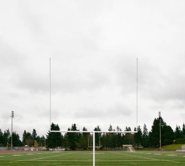 football field and goalpost - high school football stock pictures, royalty-free photos & images