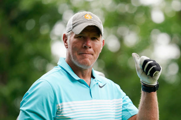 Former NFL player Brett Favre walks off the 10th tee box during the Celebrity Foursome at the second round of the American Family Insurance...
