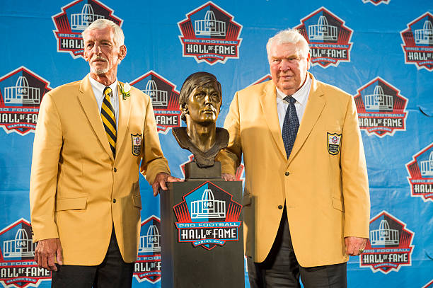 Former NFL punter Ray Guy, left, poses with his bust and former coach John Madden, right, during the NFL Class of 2014 Pro Football Hall of Fame...