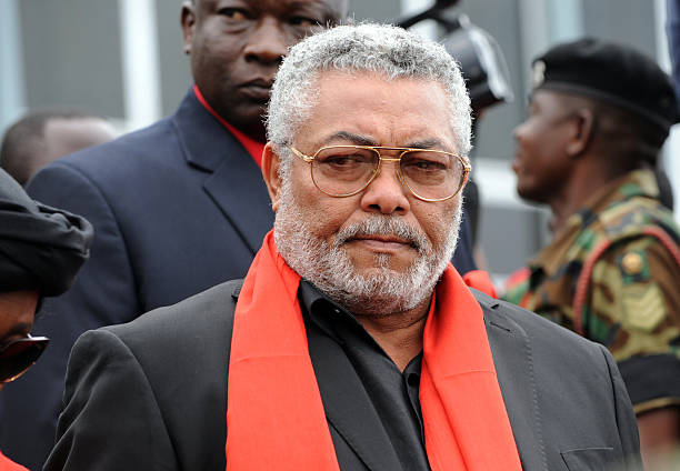 Former President Jerry Rawlings of Ghana arrives to pay last respect to late President John Atta Mills lying in state at the parliament in Accra on...