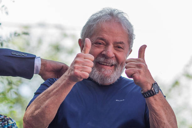 Former President Luiz Inacio Lula da Silva gestures to supporters at the headquarters of the Metalworkers' Union where a Catholic mass was held in...