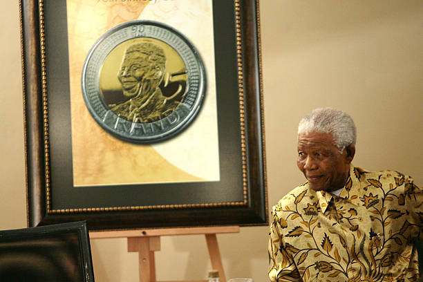 former south african president nelson mandela sits near an image of a picture id150341451?k=20&m=150341451&s=612x612&w=0&h=EbkrxR5U6QhvPX K1UgHytuOxPIdw4v S1kDrHsZjUU=