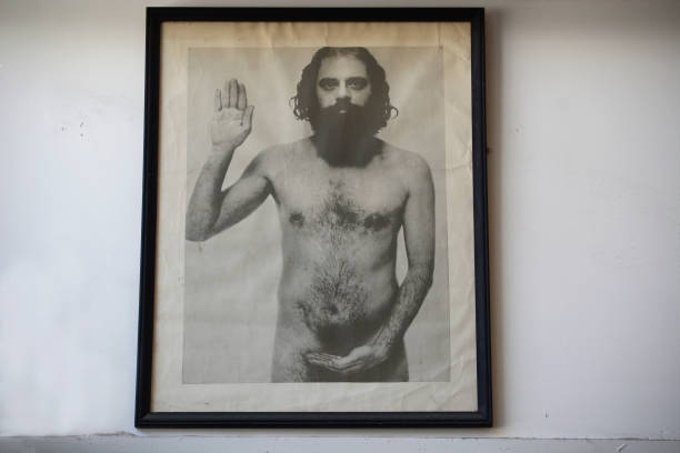 Framed photograph of a nude Allen Ginsberg is displayed on a wall at City Lights Bookstore in San Francisco, California. Ginsberg, alongside William...